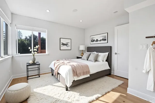 a bedroom with a bed and a couch