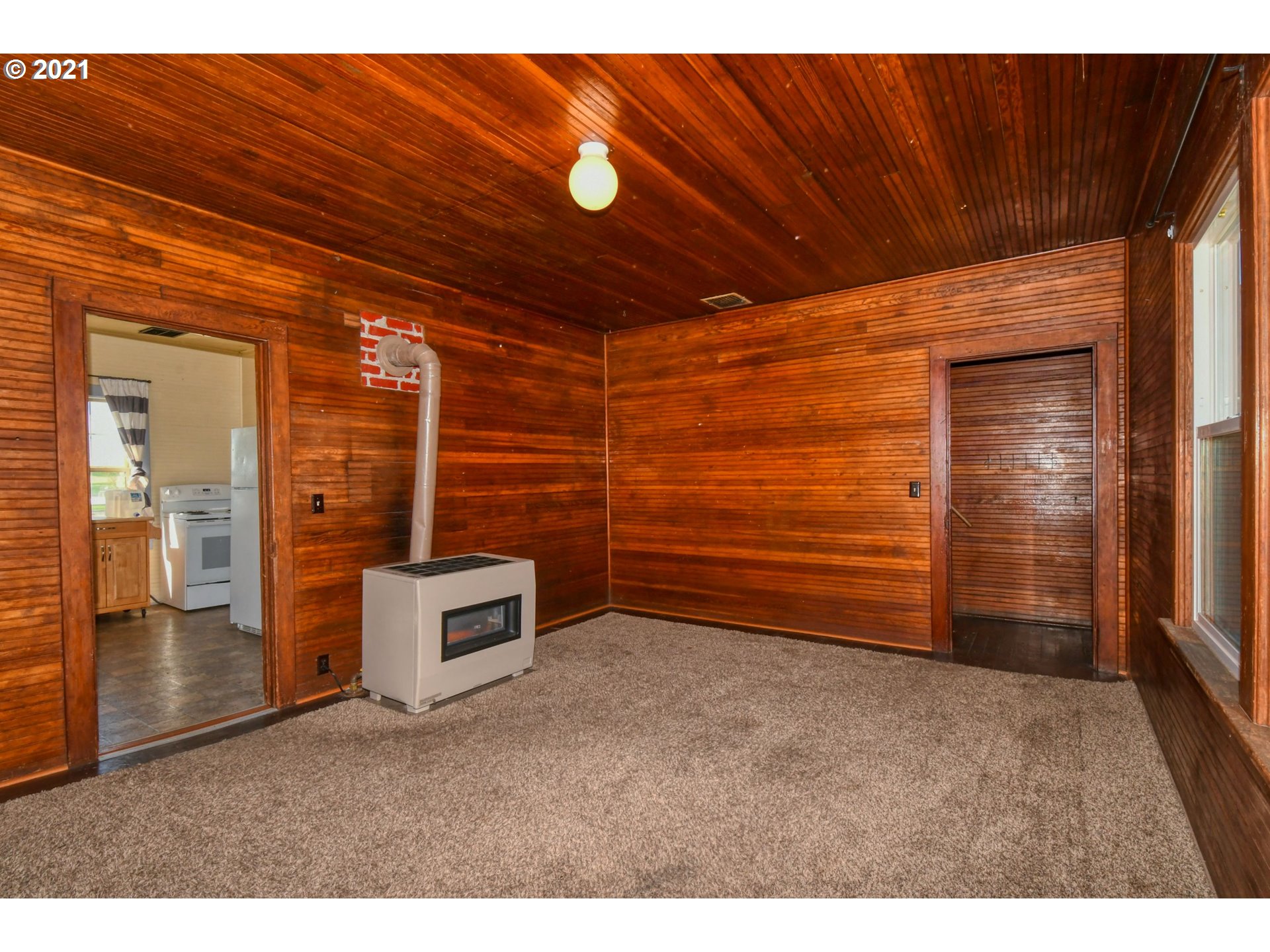 315 Vesper Street Helix, OR 97835 - Photo 11 of 32 a view of an empty room with a fireplace
