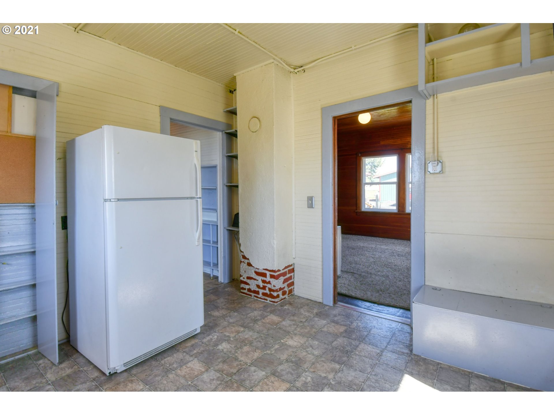 315 Vesper Street Helix, OR 97835 - Photo 14 of 32 a view of a kitchen with a refrigerator and a sink