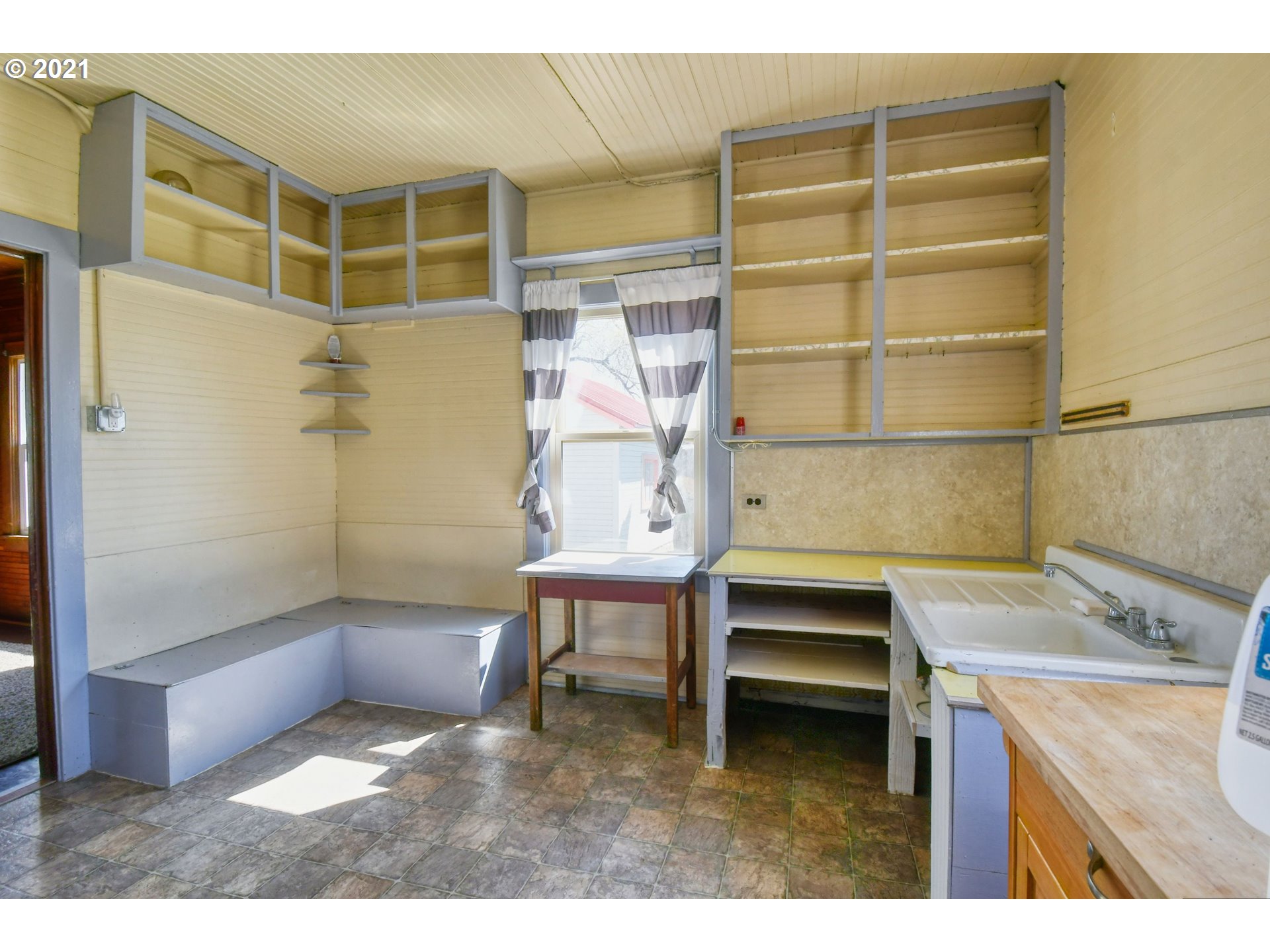 315 Vesper Street Helix, OR 97835 - Photo 15 of 32 a kitchen with a table and a sink