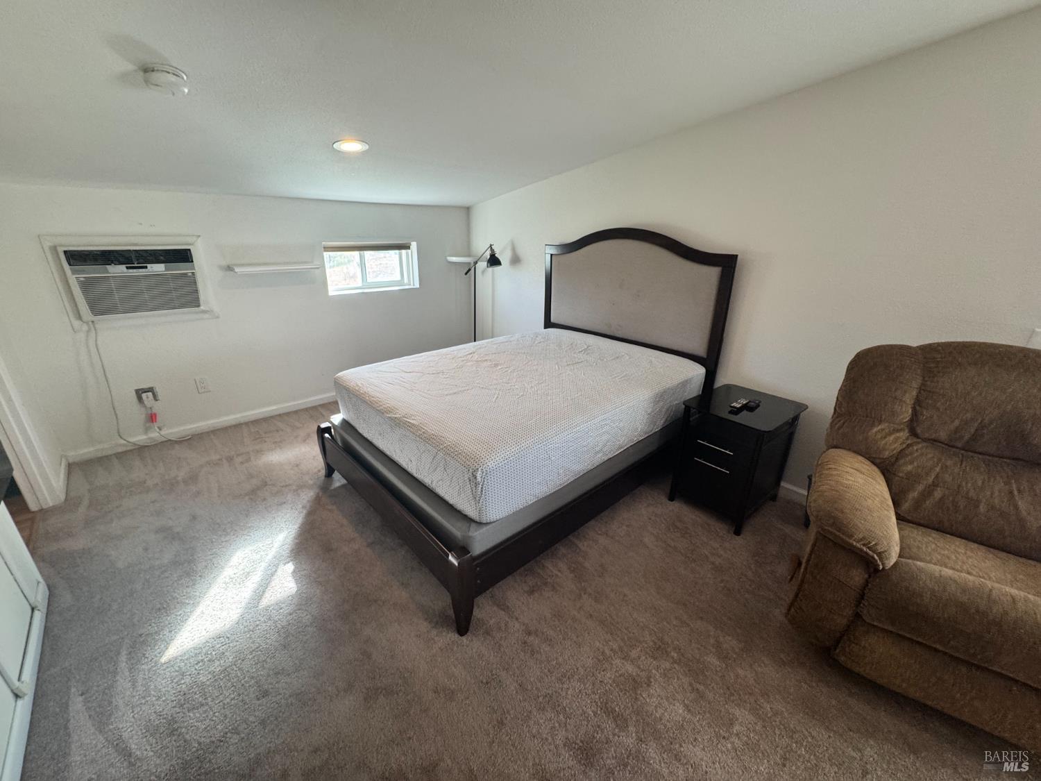 3753 Santa Rosa Avenue, Unit E Santa Rosa, CA 95407 - Photo 12 of 16 a bedroom with a bed window and couch