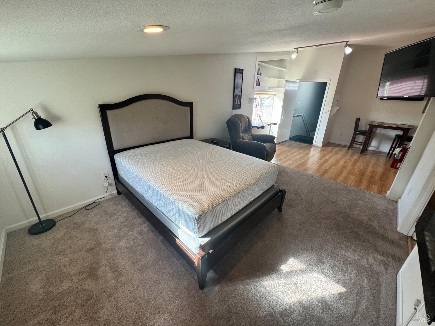 3753 Santa Rosa Avenue, Unit E Santa Rosa, CA 95407 - Photo 14 of 16 a bedroom with a bed and window