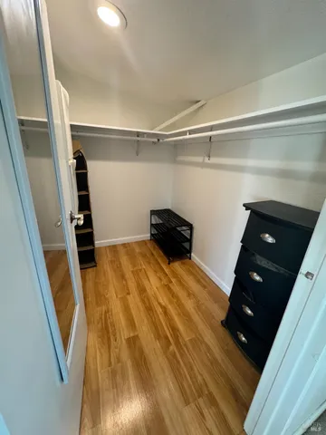 a bedroom with a bed and a shower