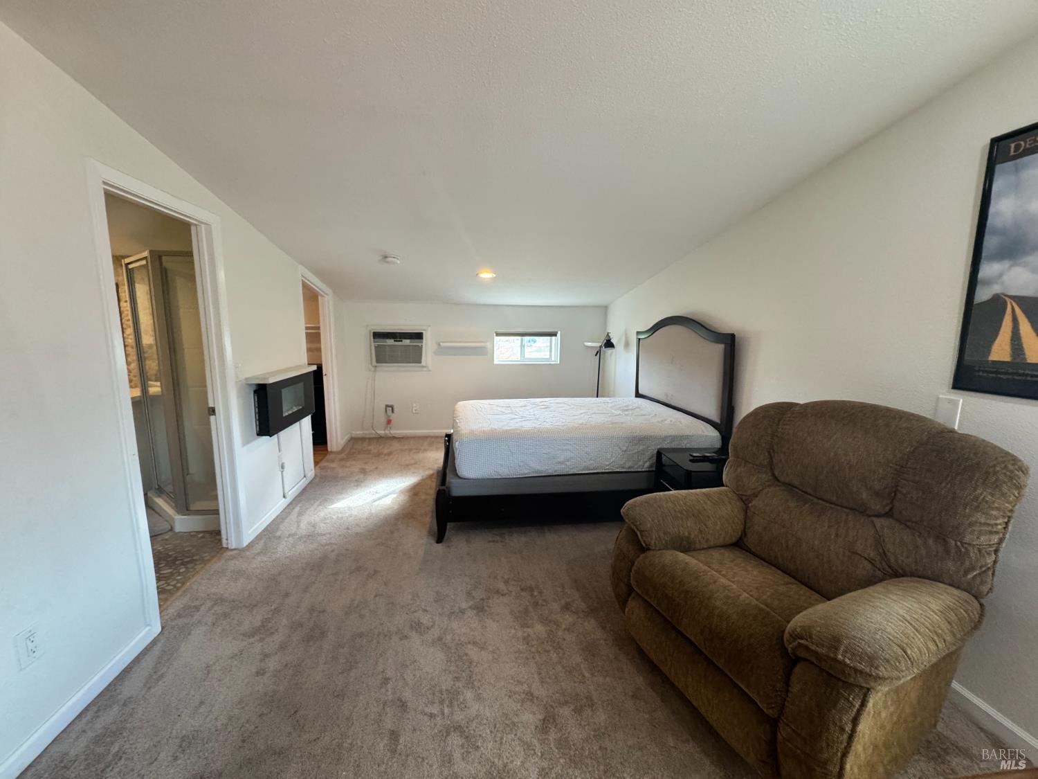 3753 Santa Rosa Avenue, Unit E Santa Rosa, CA 95407 - Photo 7 of 16 a living room with furniture and a fireplace