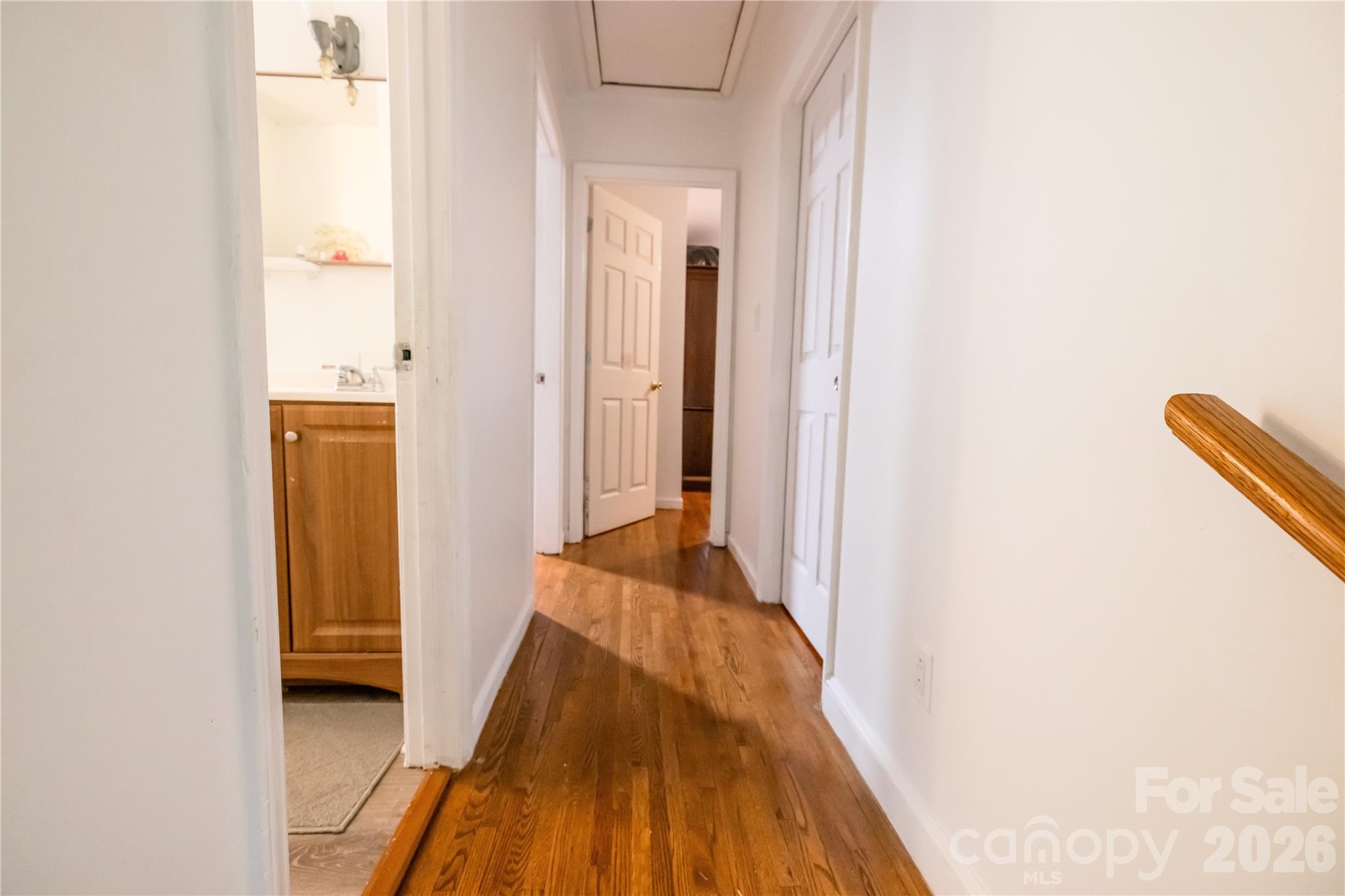2545 Cedarwild Road Charlotte, NC 28212 - Photo 3 of 25 a view of a hallway with wooden floor