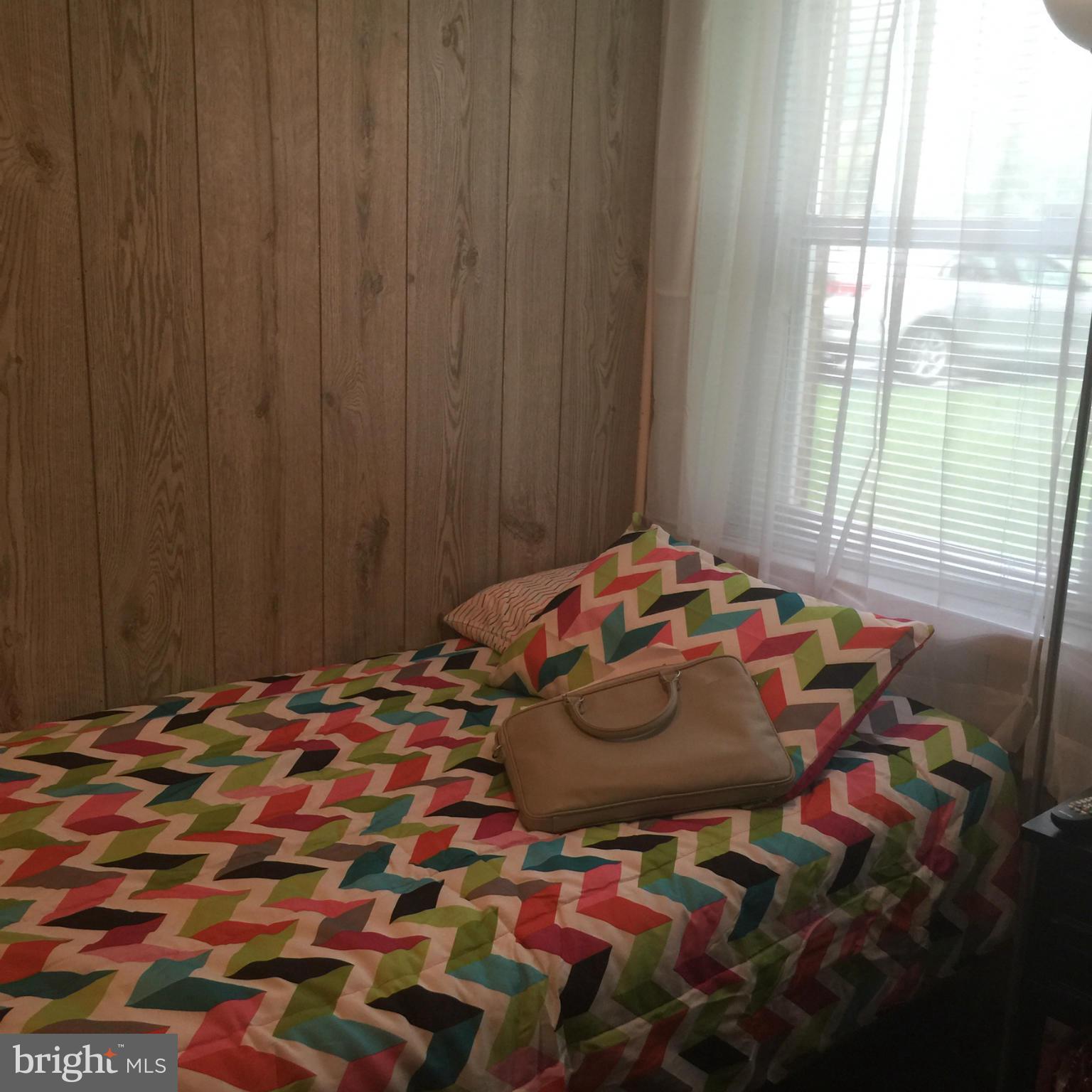 14909 Schall Road Accokeek, MD 20607 - Photo 18 of 22 a bedroom with a bed and a window