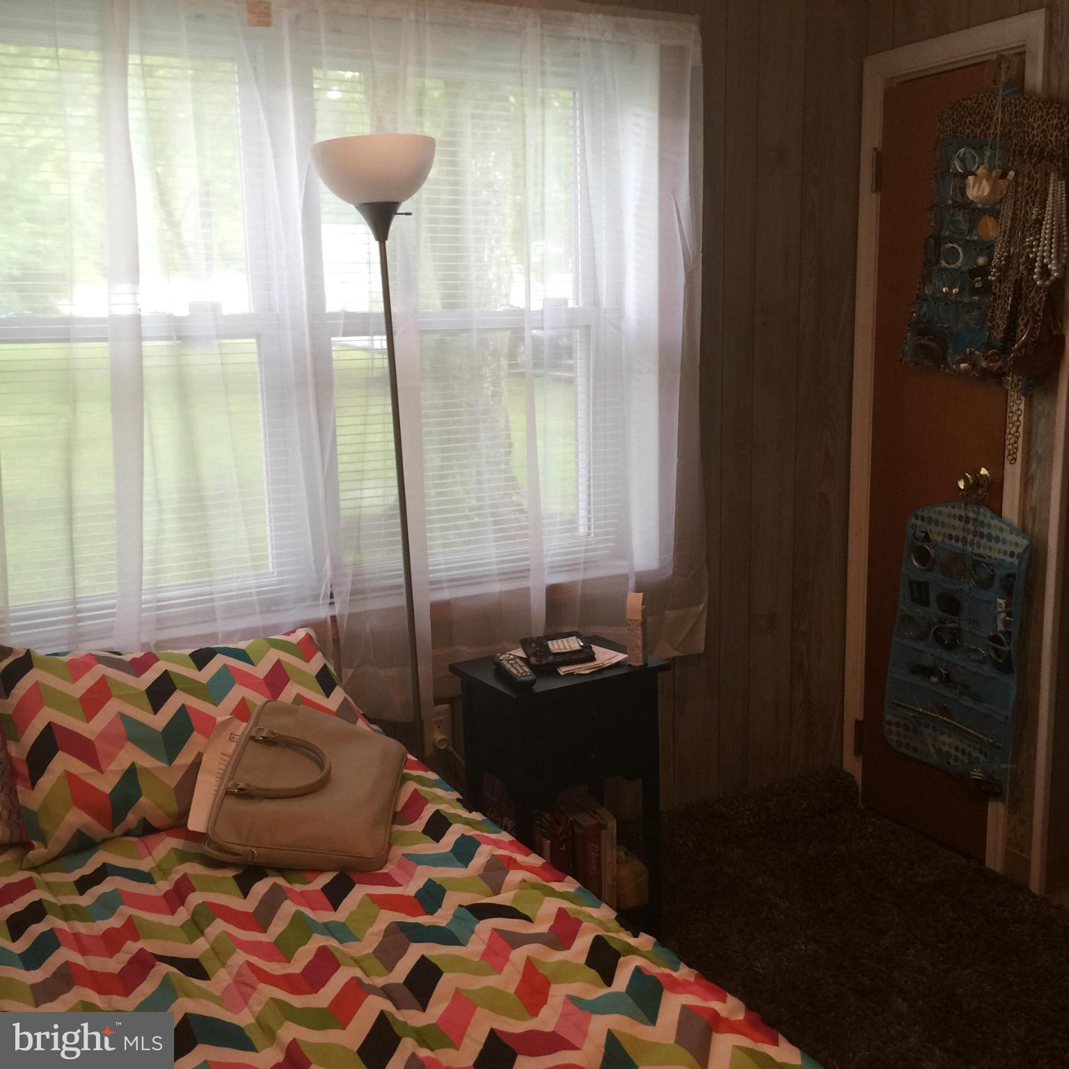 14909 Schall Road Accokeek, MD 20607 - Photo 20 of 22 a bedroom with a bed and a window
