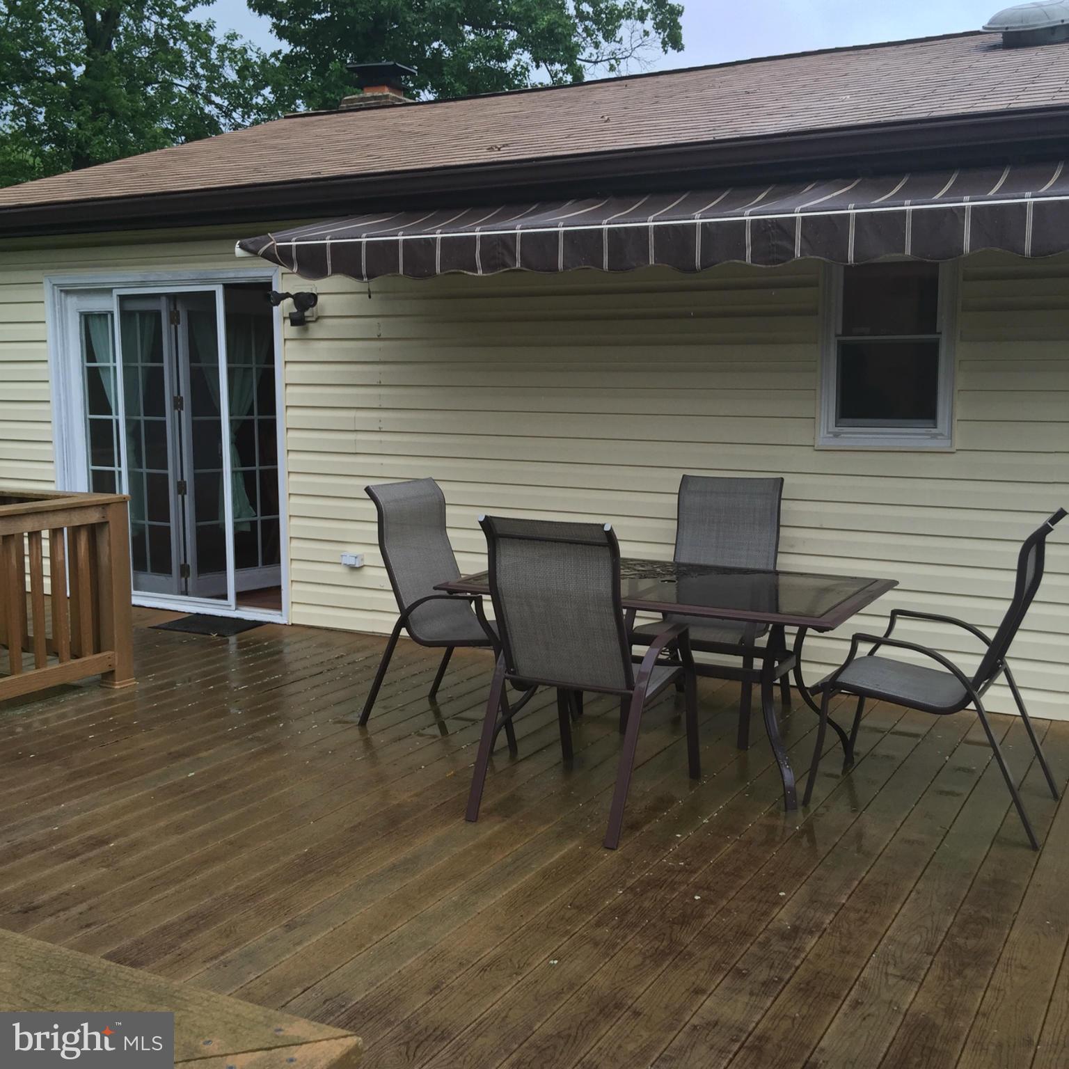 14909 Schall Road Accokeek, MD 20607 - Photo 6 of 22 a view of table and chair with wooden floor