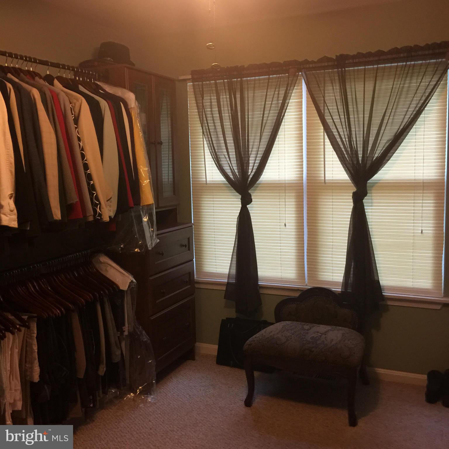 14909 Schall Road Accokeek, MD 20607 - Photo 10 of 22 a view of walk in closet with clothes and shoes