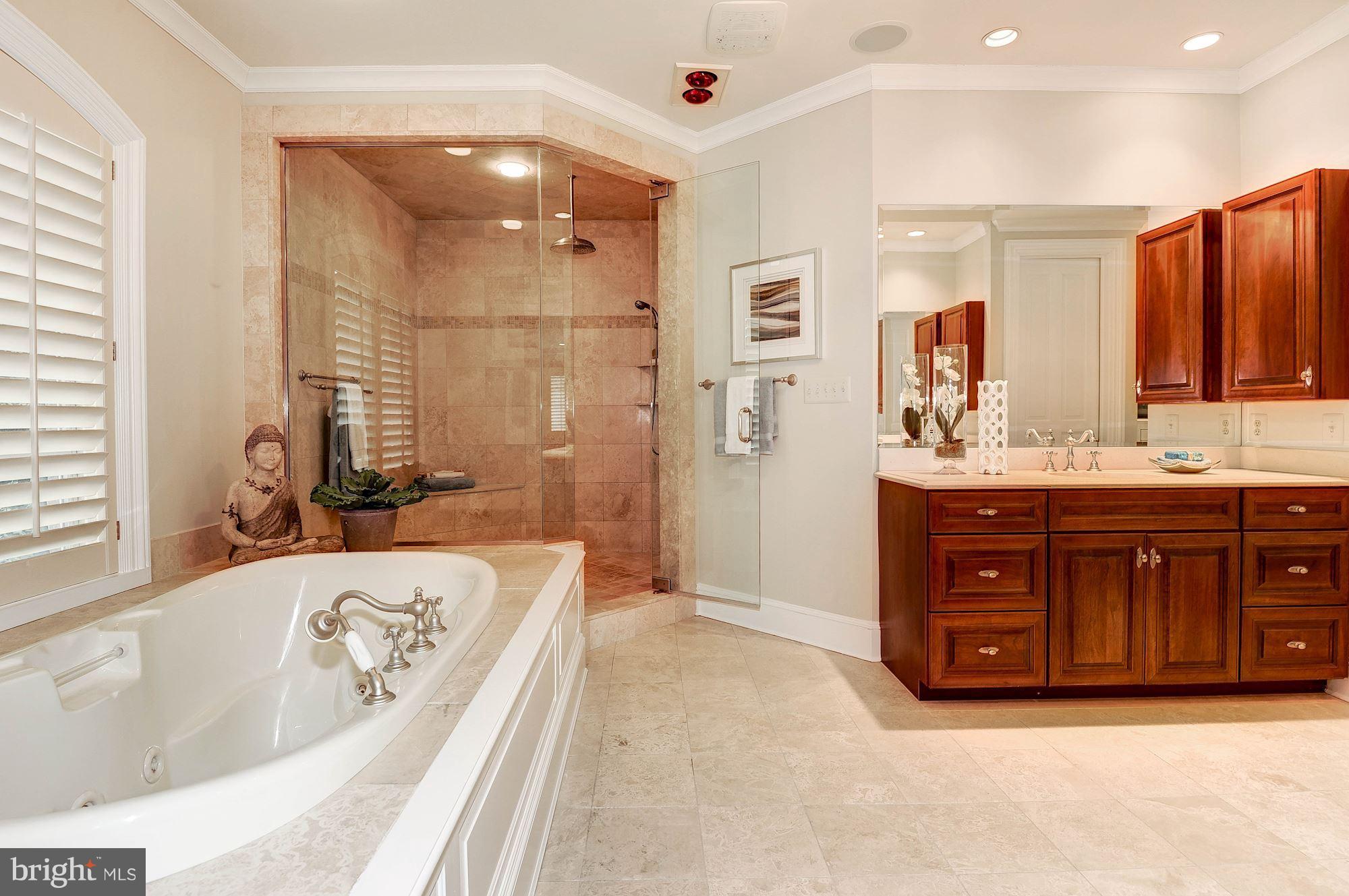 11400 Glen Road Potomac, MD 20854 - Photo 14 of 30 a spacious bathroom with a tub sink shower and mirror