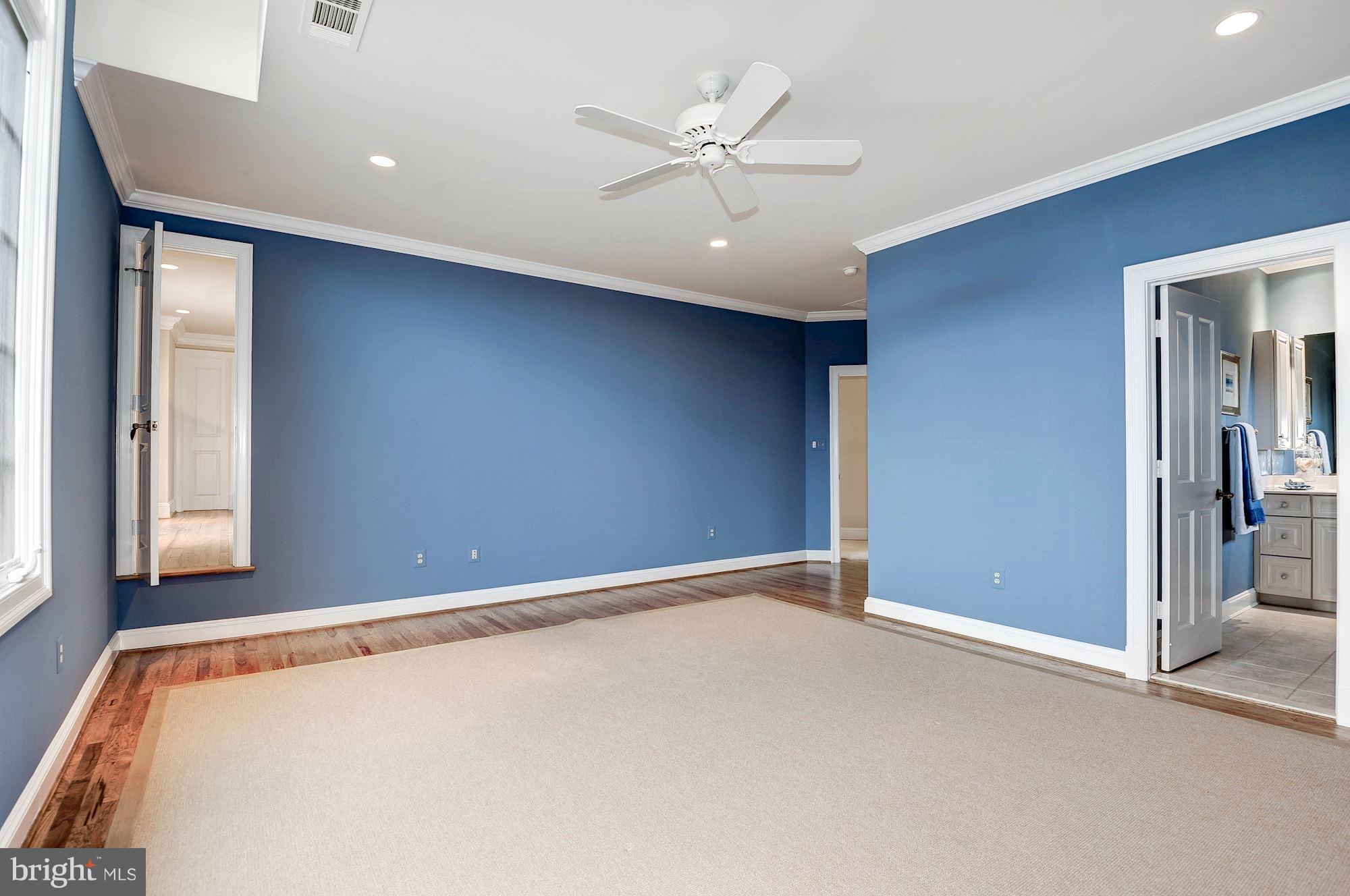 11400 Glen Road Potomac, MD 20854 - Photo 17 of 30 an empty room with window and ceiling fan
