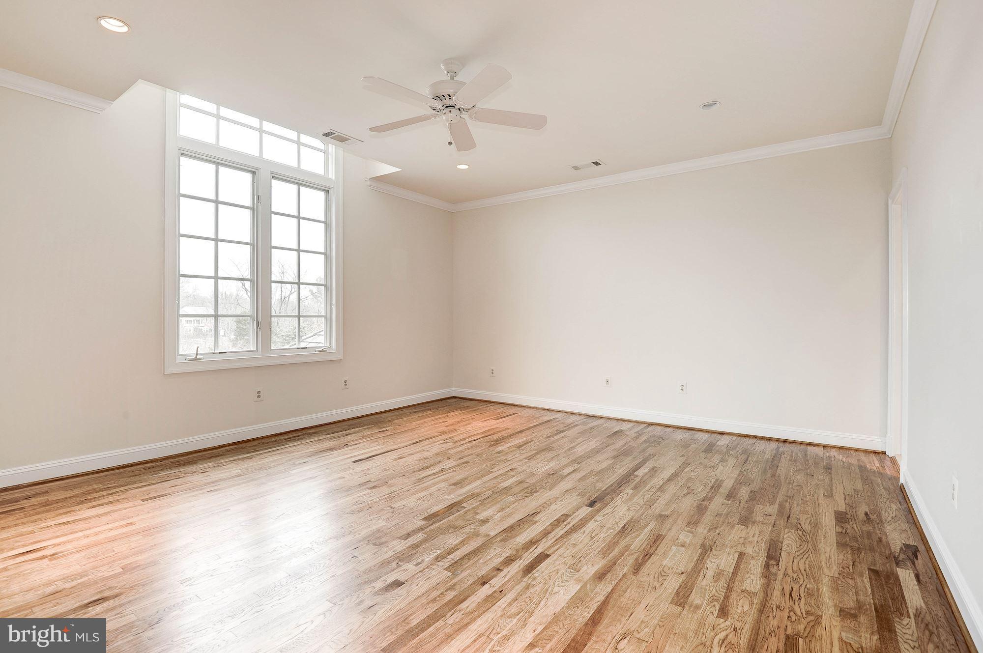 11400 Glen Road Potomac, MD 20854 - Photo 18 of 30 wooden floor in an empty room with a window