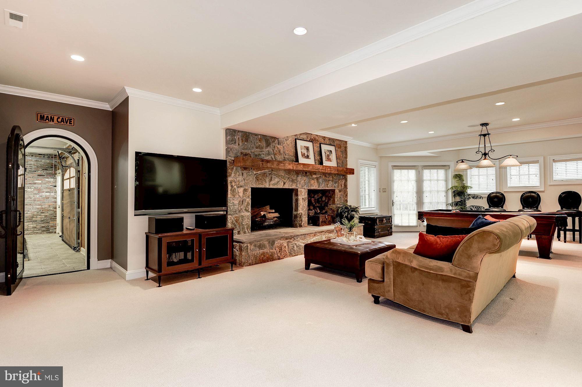 11400 Glen Road Potomac, MD 20854 - Photo 19 of 30 a living room with furniture and a flat screen tv