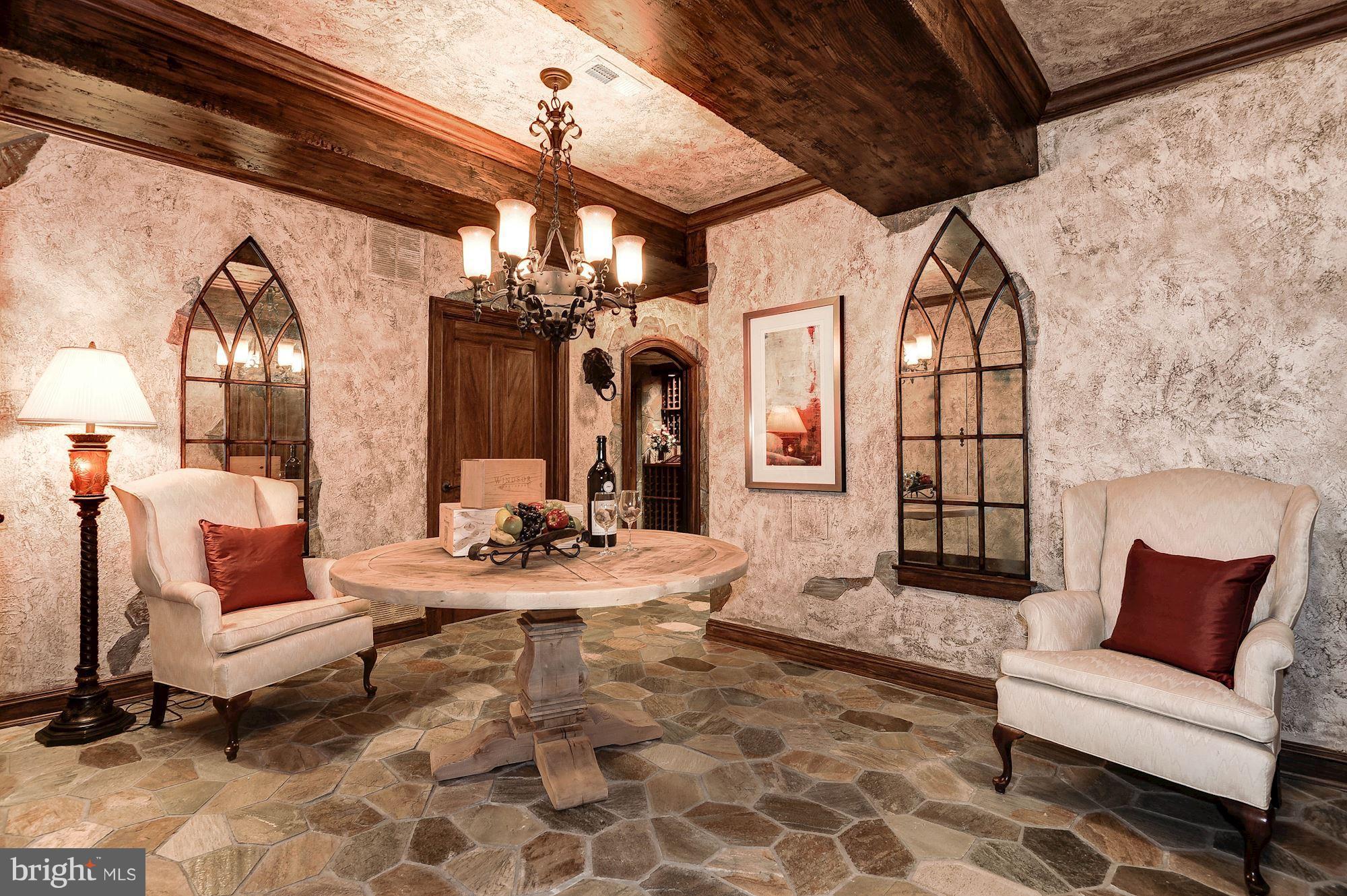 11400 Glen Road Potomac, MD 20854 - Photo 21 of 30 a living room with furniture and a chandelier