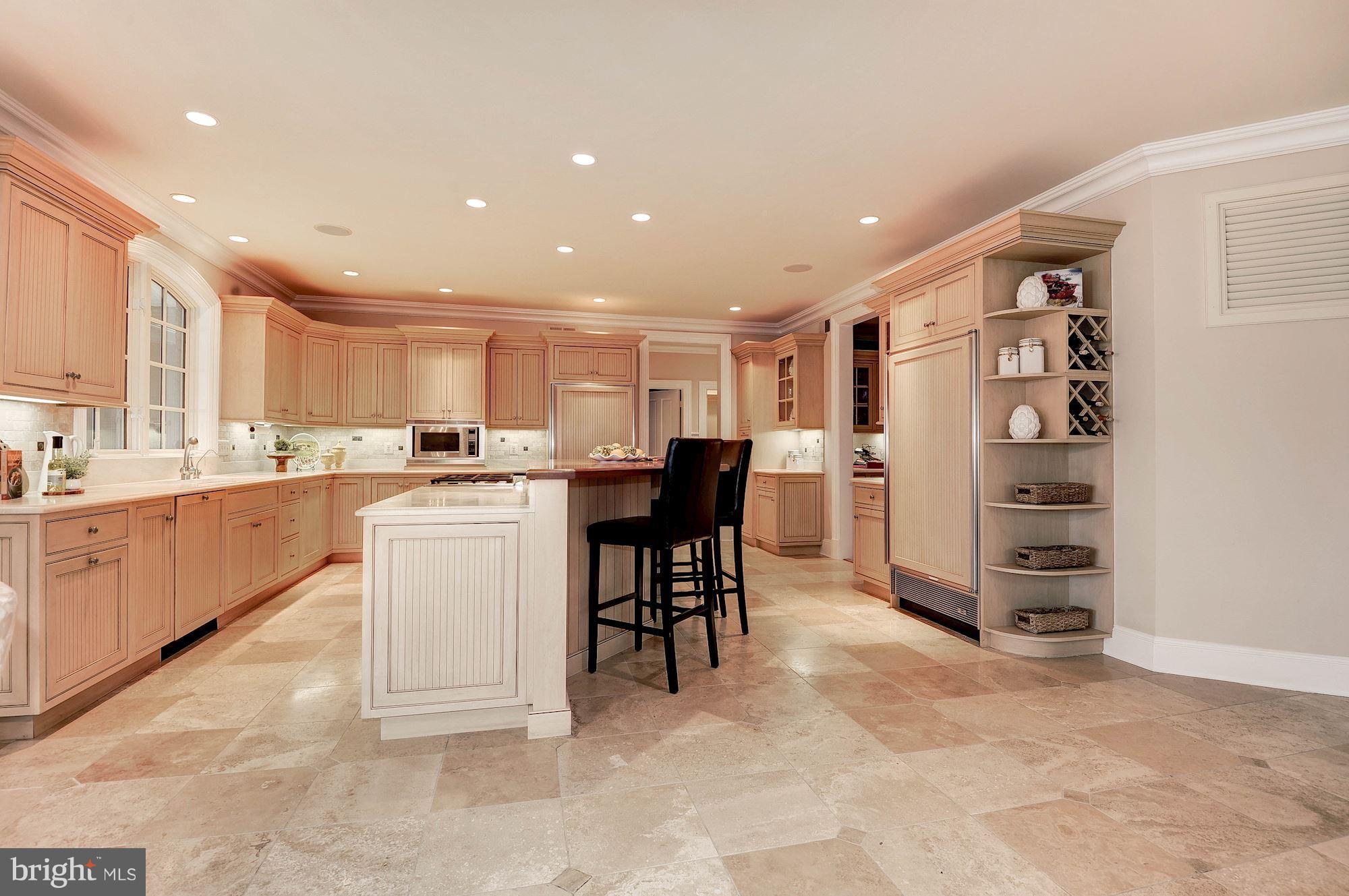 11400 Glen Road Potomac, MD 20854 - Photo 9 of 30 a kitchen with a refrigerator and a sink