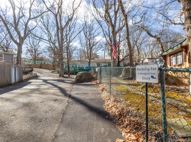 a view of a chairs and tables in the back yard of the house