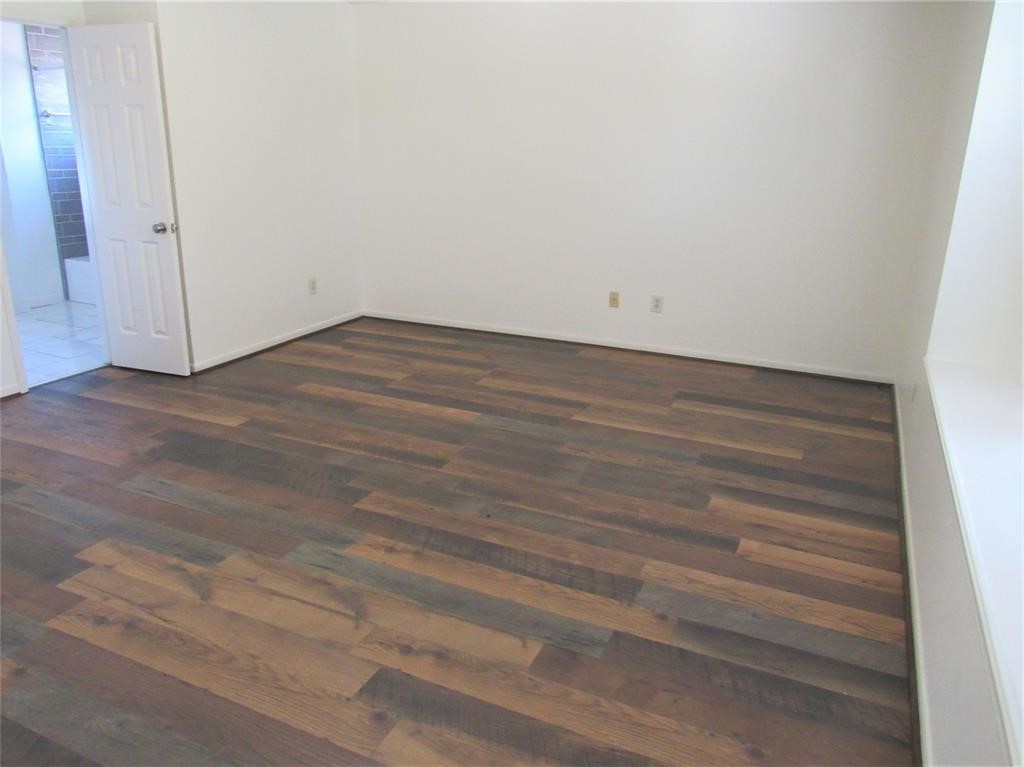 18822 Timber Way Drive Humble, TX 77346 - Photo 11 of 15 an empty room with wooden floor