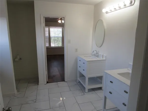 a bathroom with a sink toilet and tub