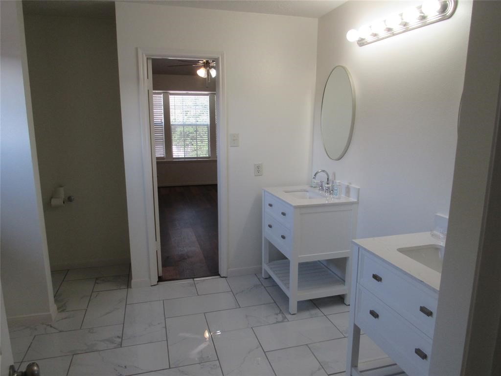 18822 Timber Way Drive Humble, TX 77346 - Photo 13 of 15 a bathroom with a sink toilet and tub