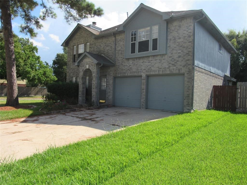 18822 Timber Way Drive Humble, TX 77346 - Photo 2 of 15 a front view of a house with a yard
