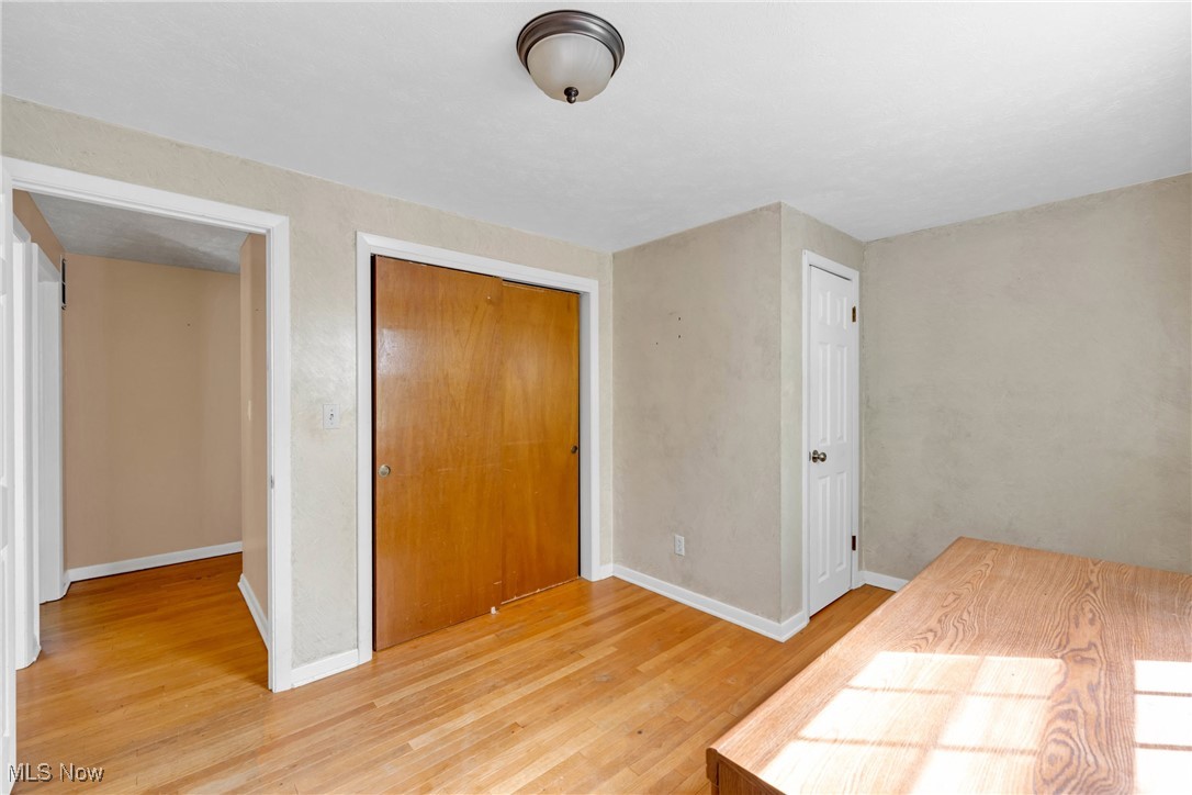 1583 Vermilion Road Vermilion, OH 44089 - Photo 15 of 41 Bedroom with hardwood floors and lare closet and attic access