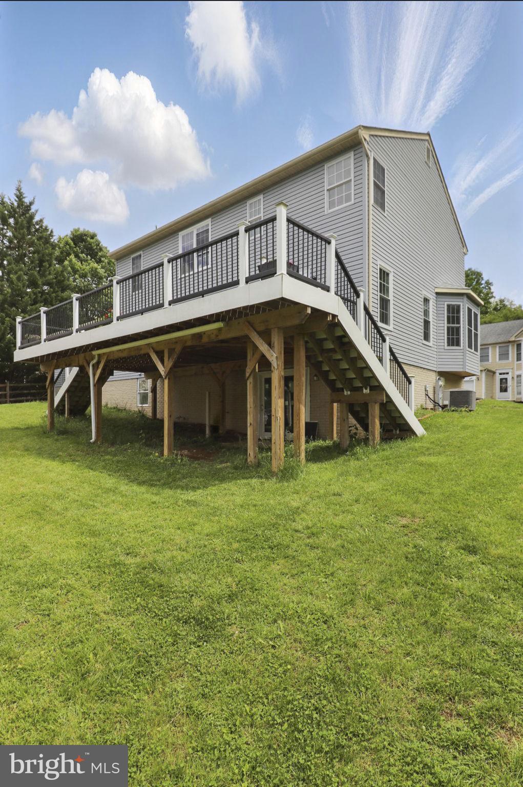9482 Ridgeview Drive Columbia, MD 21046 - Photo 26 of 86 a view of a house with a backyard porch and sitting area