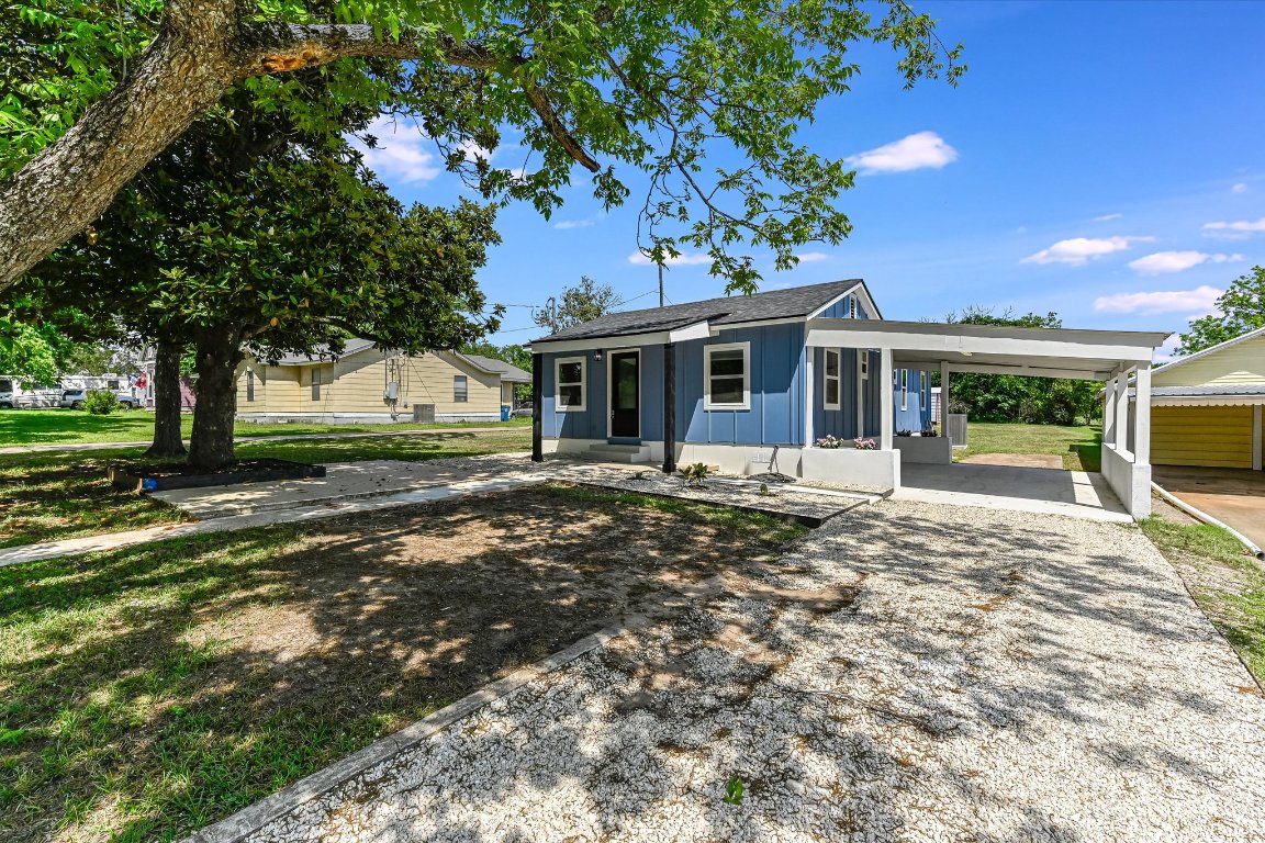 710 East 2nd Street Elgin, TX 78621 - Photo 2 of 30 a front view of a house with a garden