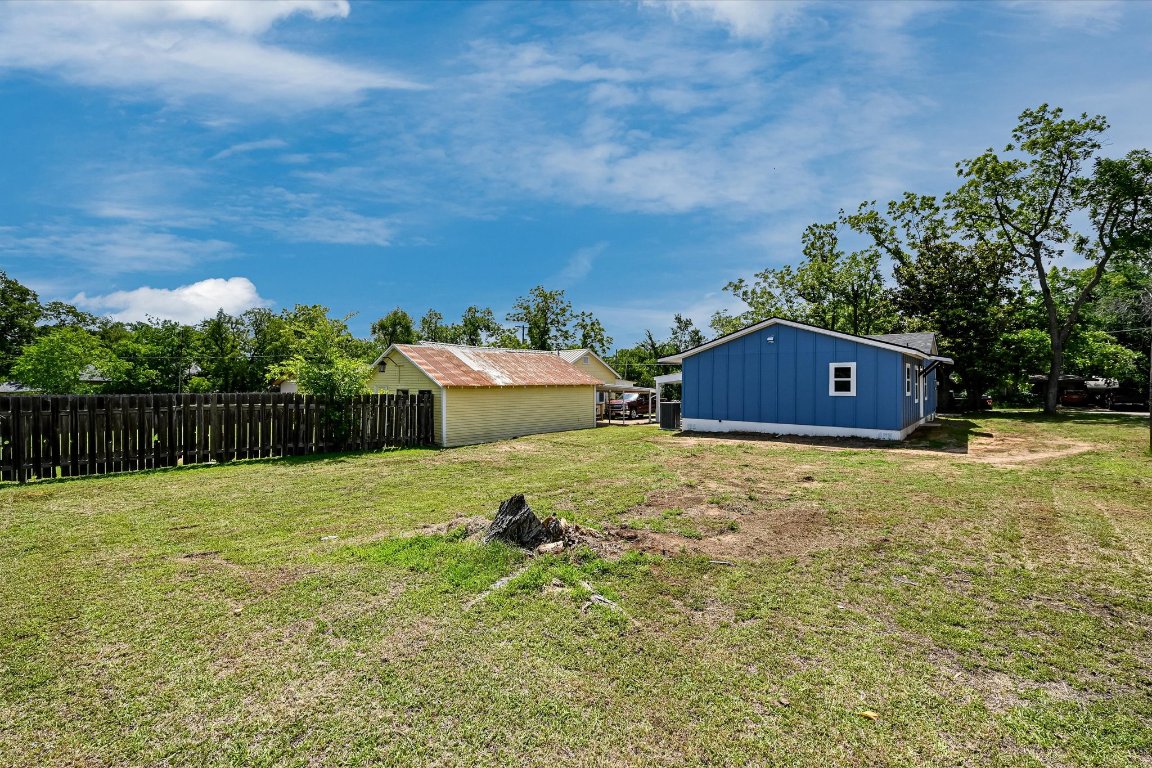 710 East 2nd Street Elgin, TX 78621 - Photo 27 of 30 a house with trees in the background