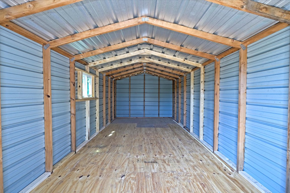 710 East 2nd Street Elgin, TX 78621 - Photo 29 of 30 a view of a wooden deck besides a house