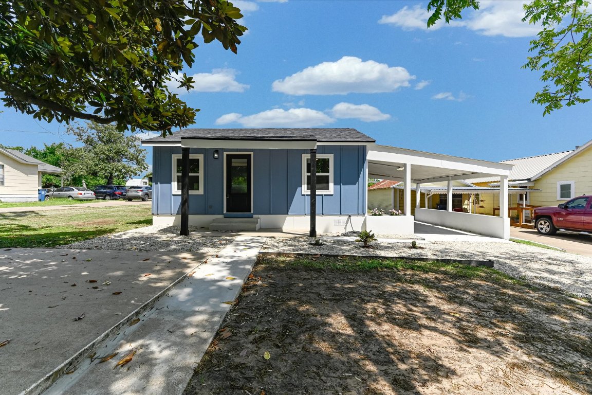 710 East 2nd Street Elgin, TX 78621 - Photo 3 of 30 a front view of a house with a yard
