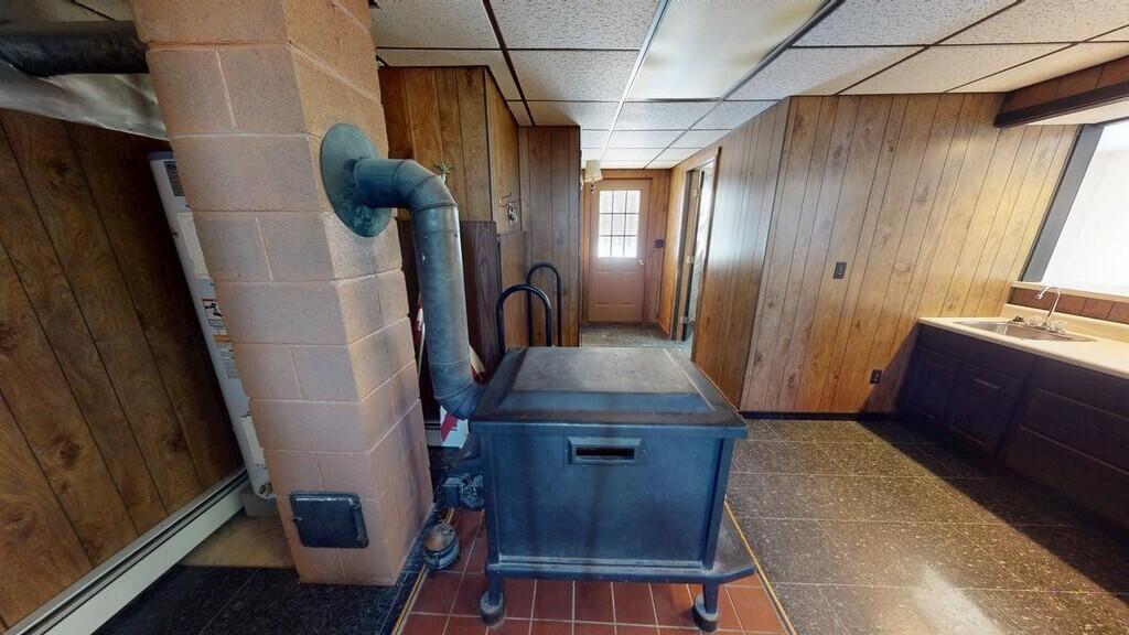 43 Heritage Street Millinocket, ME 04462 - Photo 34 of 62 34 43-Heritage-St-Wood-stove (Copy)