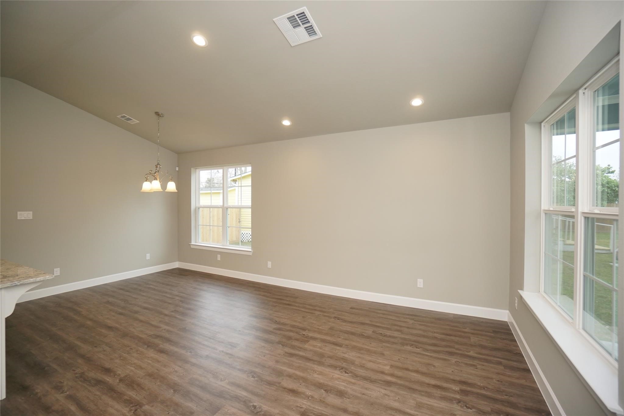 1137 4th Street Rosenberg, TX 77471 - Photo 7 of 16 an empty room with wooden floor and windows