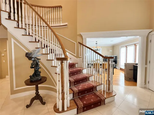 a view of entryway with wooden floor and stairs