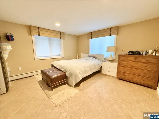 a bedroom with a bed and dresser