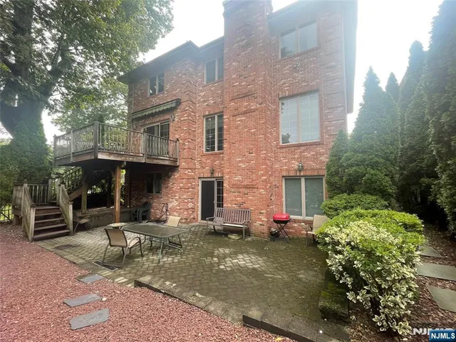 a front view of house with outdoor seating