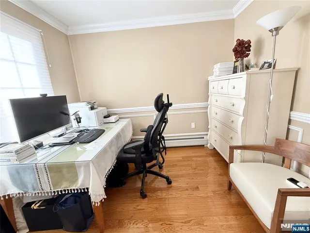 a bedroom with a bed and a chair in it