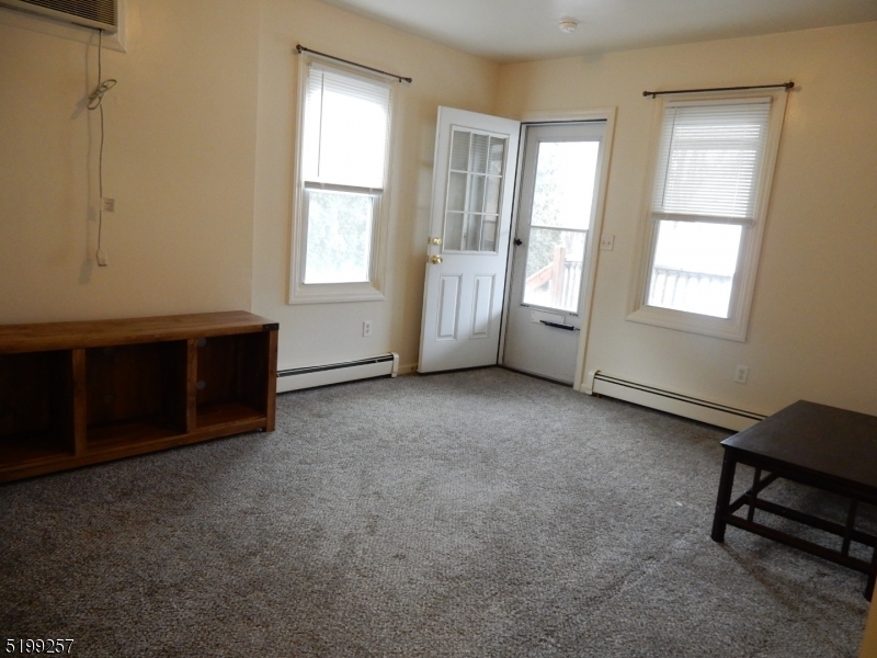 134 Main Street, Unit 3 Netcong, NJ 07857 - Photo 2 of 10 an empty room with windows