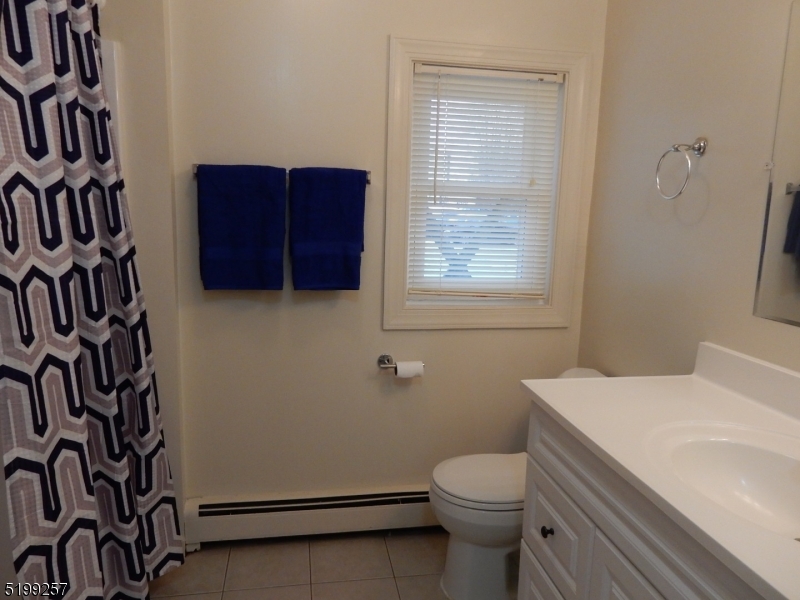 134 Main Street, Unit 3 Netcong, NJ 07857 - Photo 6 of 10 a bathroom with a toilet and a sink