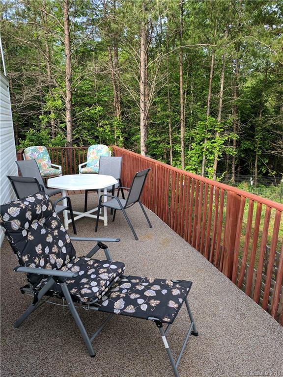 2158 Coopers Gap Road Rutherfordton, NC 28139 - Photo 25 of 27 a view of a chairs and table in the roof deck