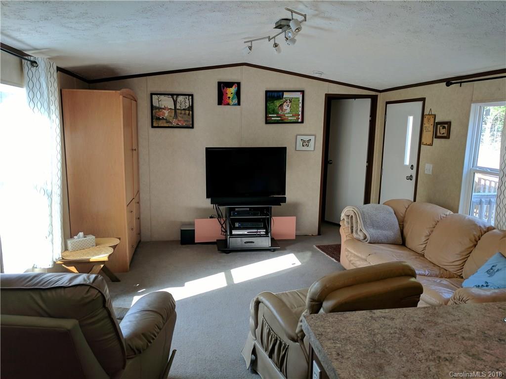 2158 Coopers Gap Road Rutherfordton, NC 28139 - Photo 9 of 27 a living room with furniture and a flat screen tv