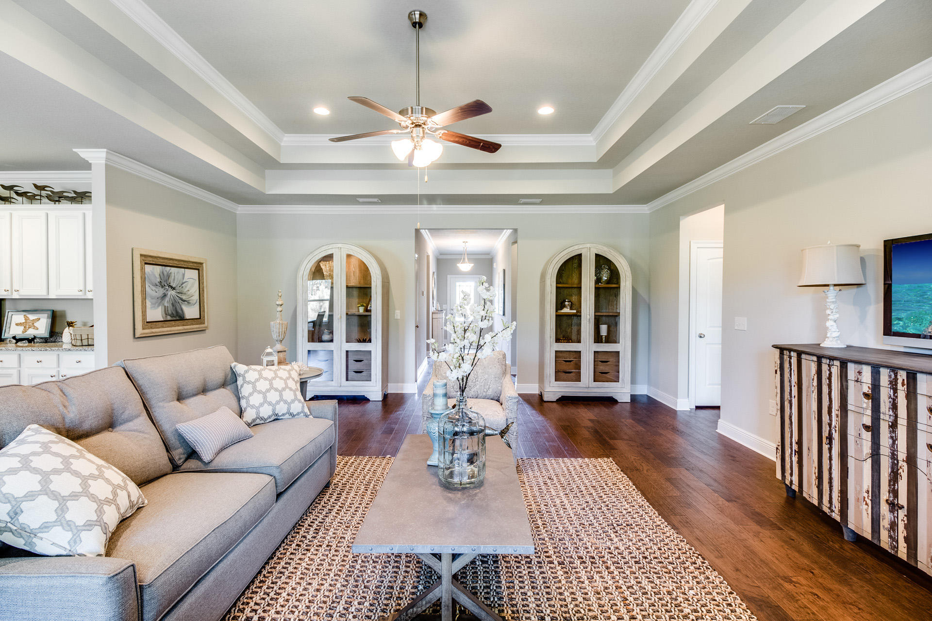 288 Conner Circle Santa Rosa Beach, FL 32459 - Photo 7 of 44 a living room with furniture chandelier and a fireplace