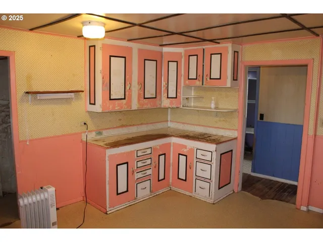 a kitchen with stainless steel appliances granite countertop a stove and a microwave