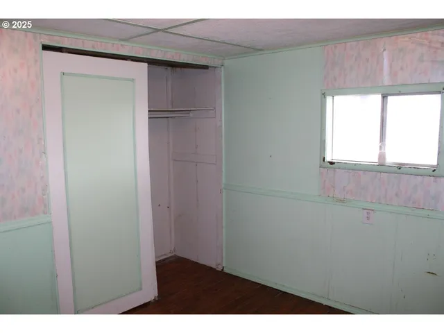 a utility room with a shower and cabinets