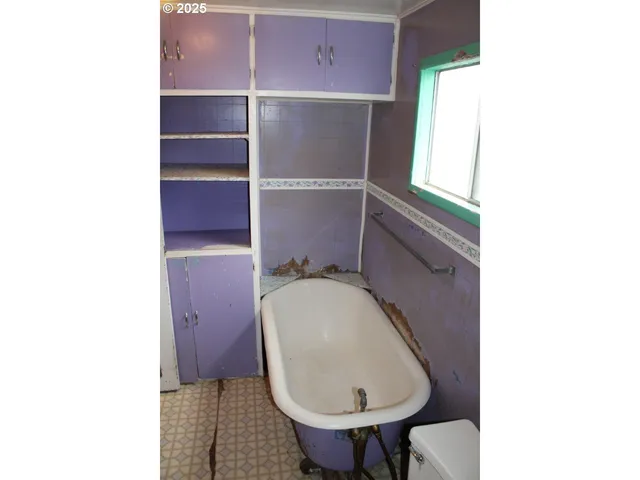 a bathroom with a toilet and a sink