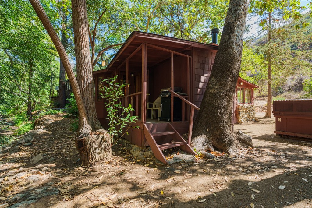 0 Hot Springs Canyon Road, Unit 26 Trabuco Canyon, CA 92679 - Photo 21 of 59 a view of a house with backyard and trees