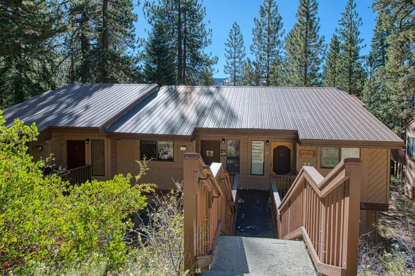 a kitchen that has a sink and a stove in it