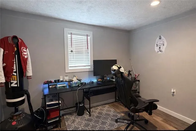 a room with furniture and wooden floor