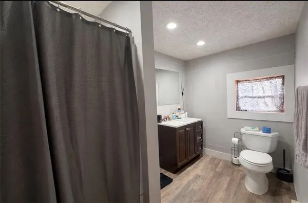a view of bathroom with a toilet sink and tub