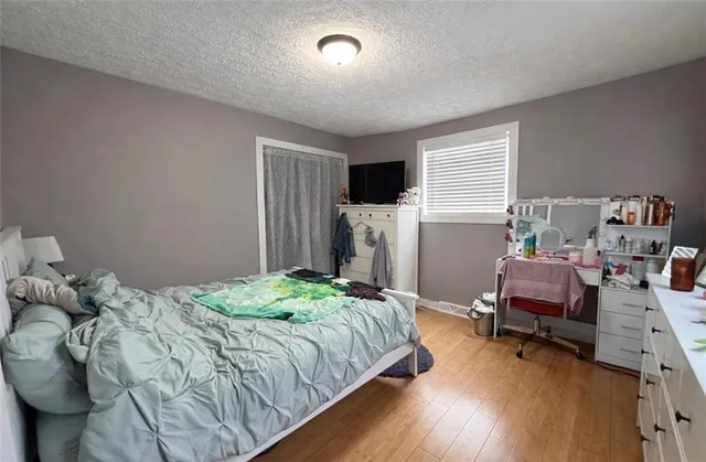 a bedroom with a bed and furniture