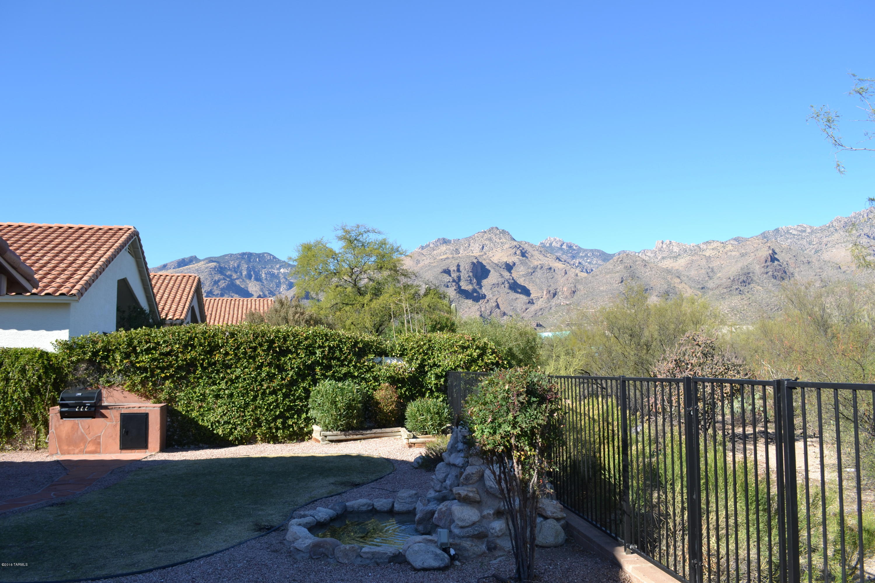 5640 North Cherokee Ridge Road Tucson, AZ 85750 - Photo 23 of 39 a view of a city from a balcony